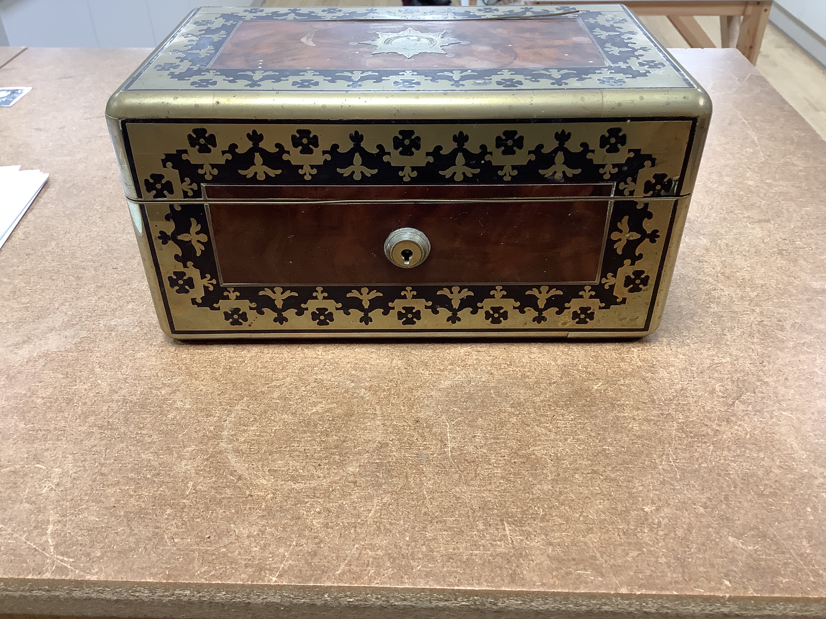 A William IV Cut brass, mahogany and ebony travelling vanity box, with silver-capped bottles, 24.5cm wide